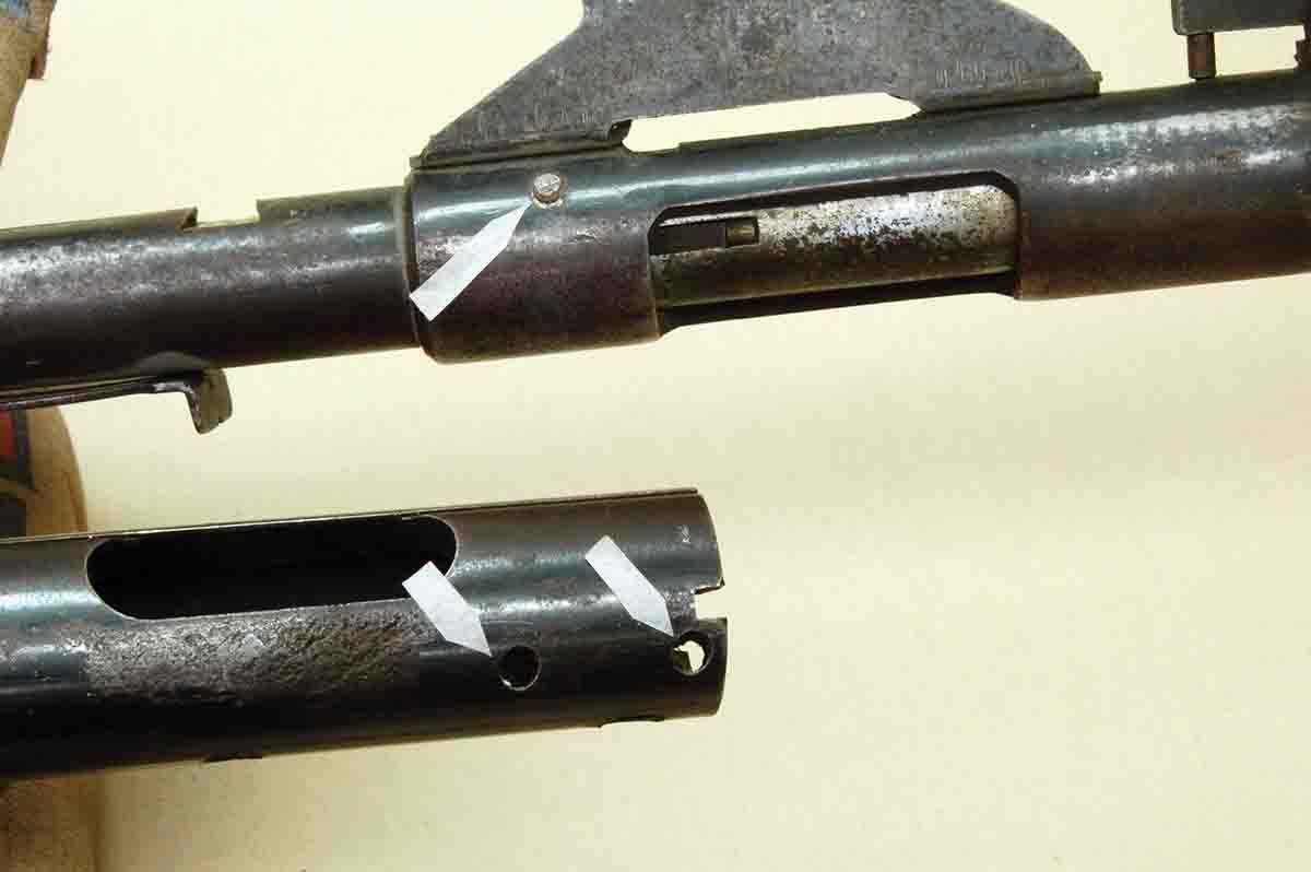 The Stevens barreled action (top) has one pin (arrow) holding the barrel in the receiver. Below it, a Remington M580 action includes only two pins.